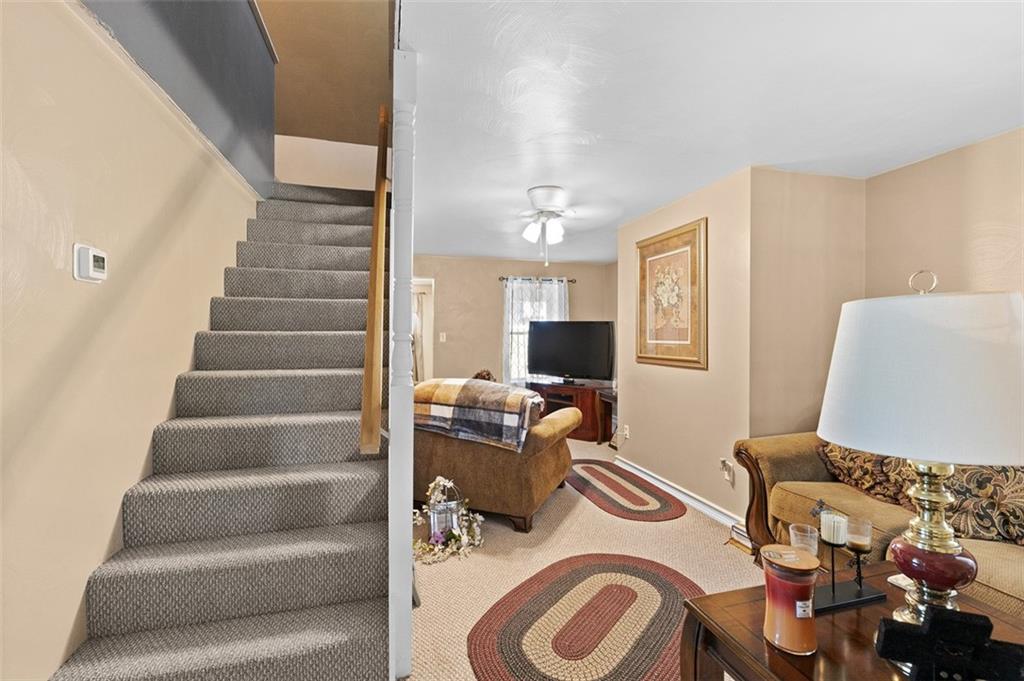 199 Water Street Dickerson Run, PA 15430 - Photo 14 of 22 a living room with furniture and a flat screen tv