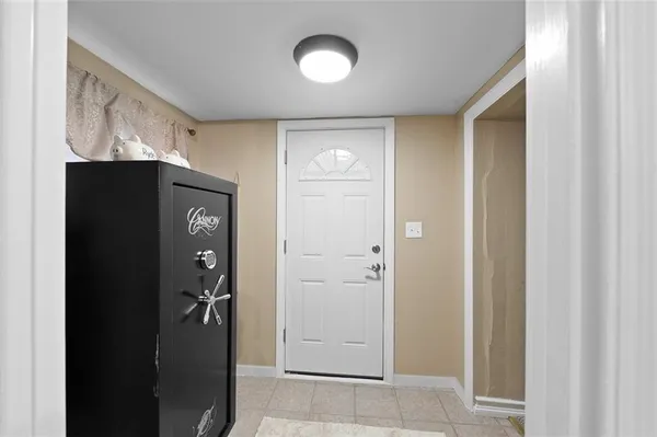 a view of a hallway with wooden shelves