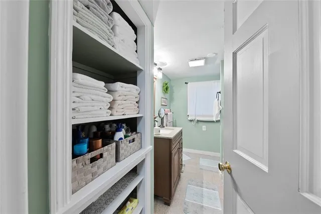 a kitchen with stainless steel appliances granite countertop a refrigerator and a wooden cabinets