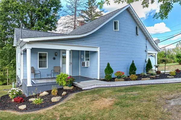 a view of a house with chair in the patio