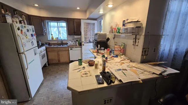 a close view of dining table chairs and entryway