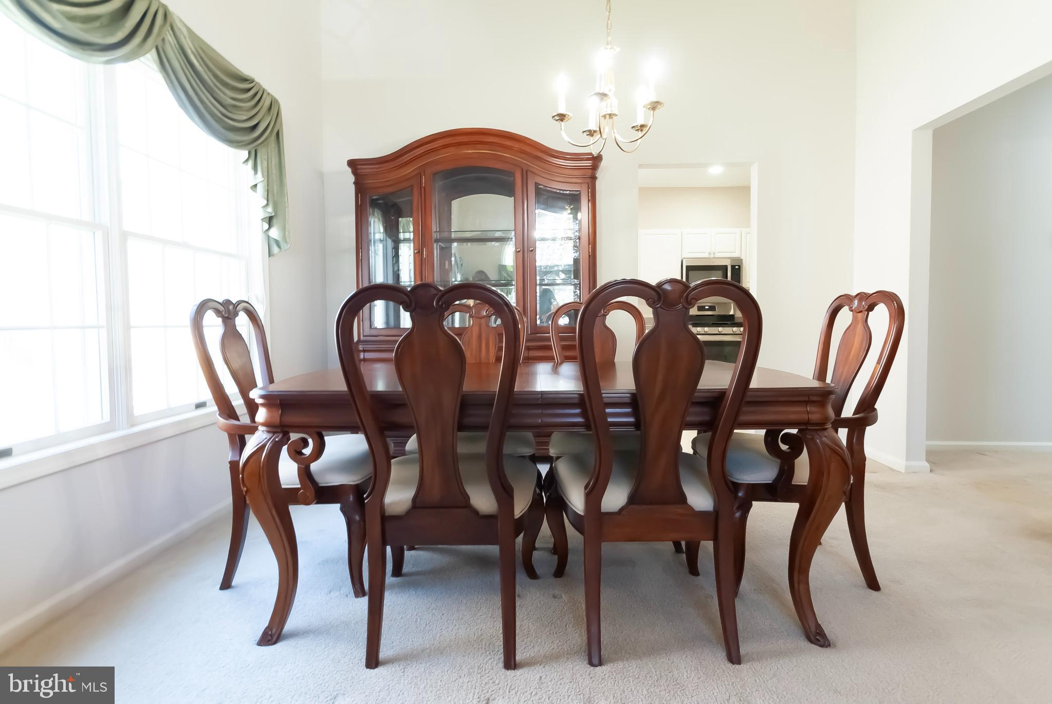 89 Lantern Lane Columbus, NJ 08022 - Photo 12 of 55 a view of a dining room with furniture and chandelier