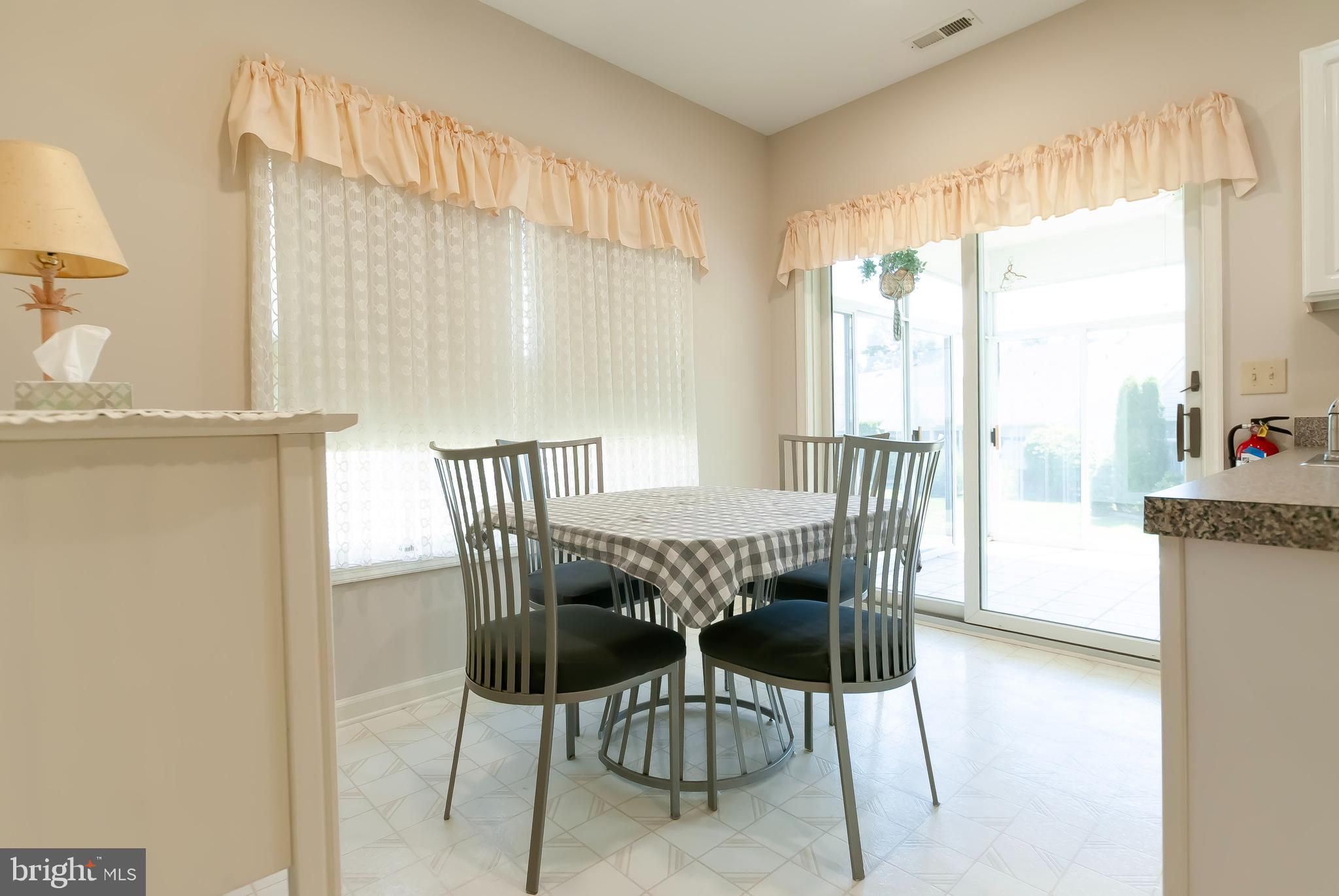 89 Lantern Lane Columbus, NJ 08022 - Photo 18 of 55 a view of a dining room with furniture and wooden floor
