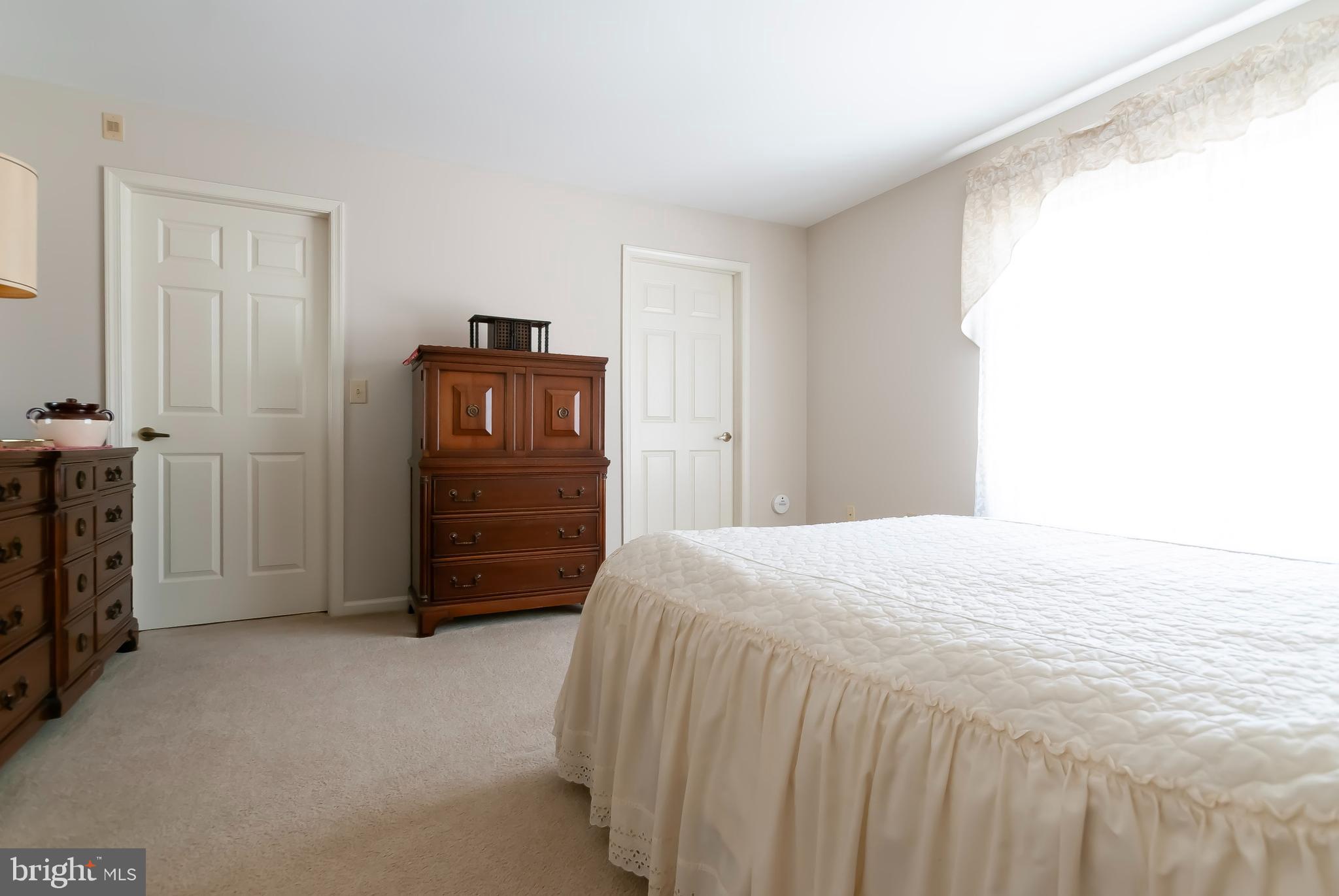 89 Lantern Lane Columbus, NJ 08022 - Photo 35 of 55 a bedroom with a bed and cabinets