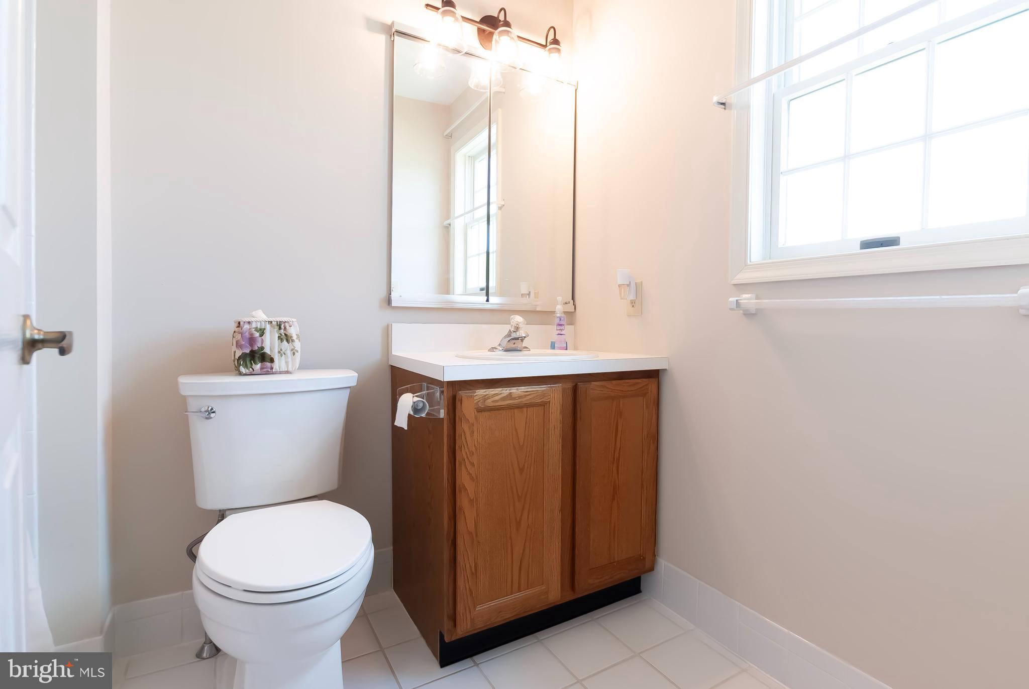 89 Lantern Lane Columbus, NJ 08022 - Photo 36 of 55 a bathroom with a sink a toilet and a mirror
