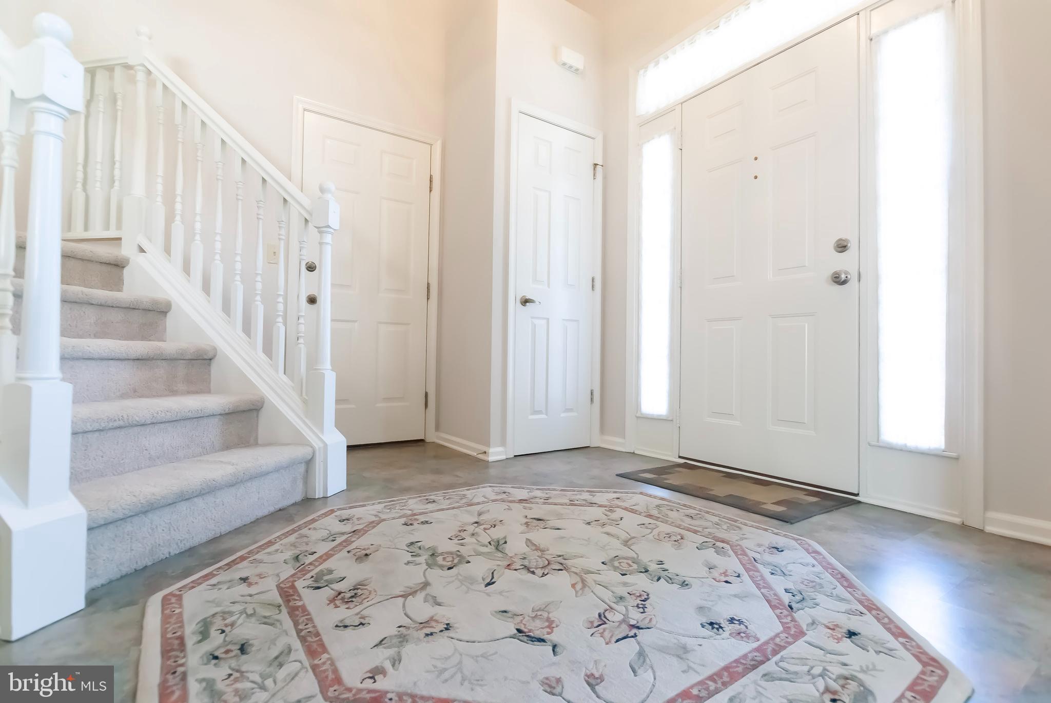 89 Lantern Lane Columbus, NJ 08022 - Photo 5 of 55 a view of a hallway with wooden floor and entryway view