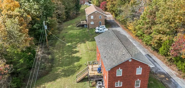 a aerial view of a house with a yard