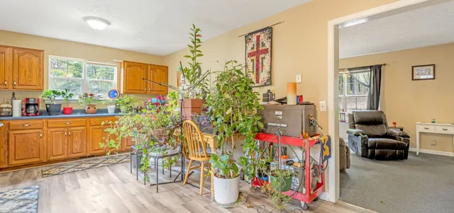 a very nice looking room with many windows and furniture