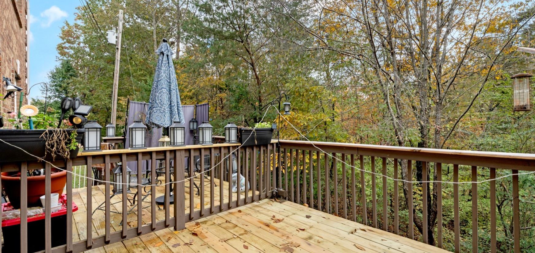 10092 Sneed Road Lyles, TN 37098 - Photo 26 of 31 a wooden deck with trees in front of it
