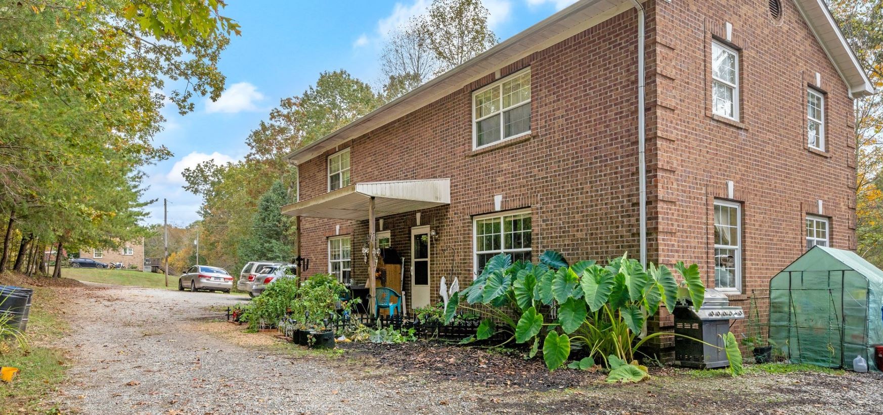 10092 Sneed Road Lyles, TN 37098 - Photo 5 of 31 a view of a yard with plants and trees