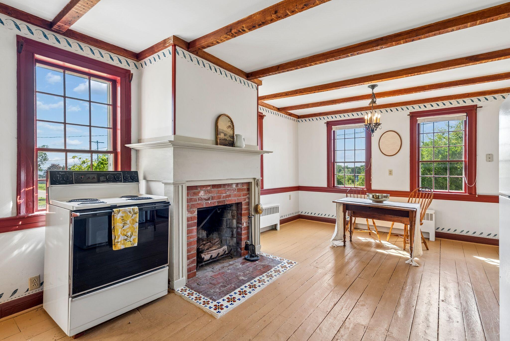 77 Lowells Cove Road Harpswell, ME 04066 - Photo 15 of 32 Kitchen & Dining with Fireplace