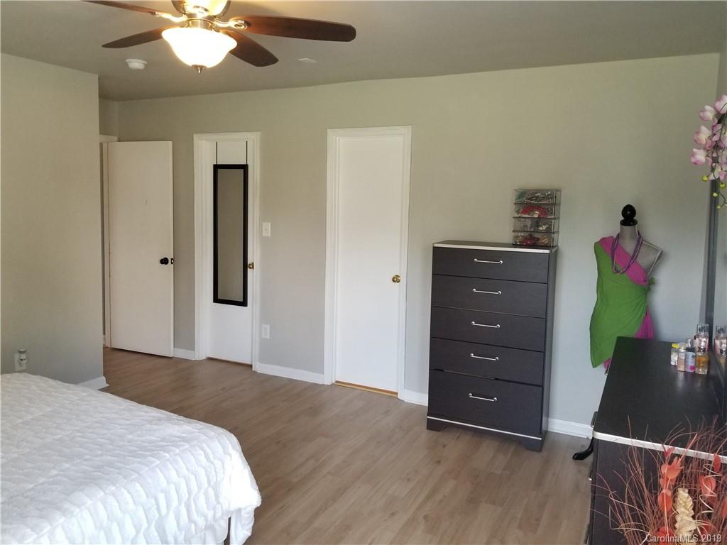 2125 Pimpernel Road Charlotte, NC 28213 - Photo 22 of 31 a bedroom with a bed and a dresser