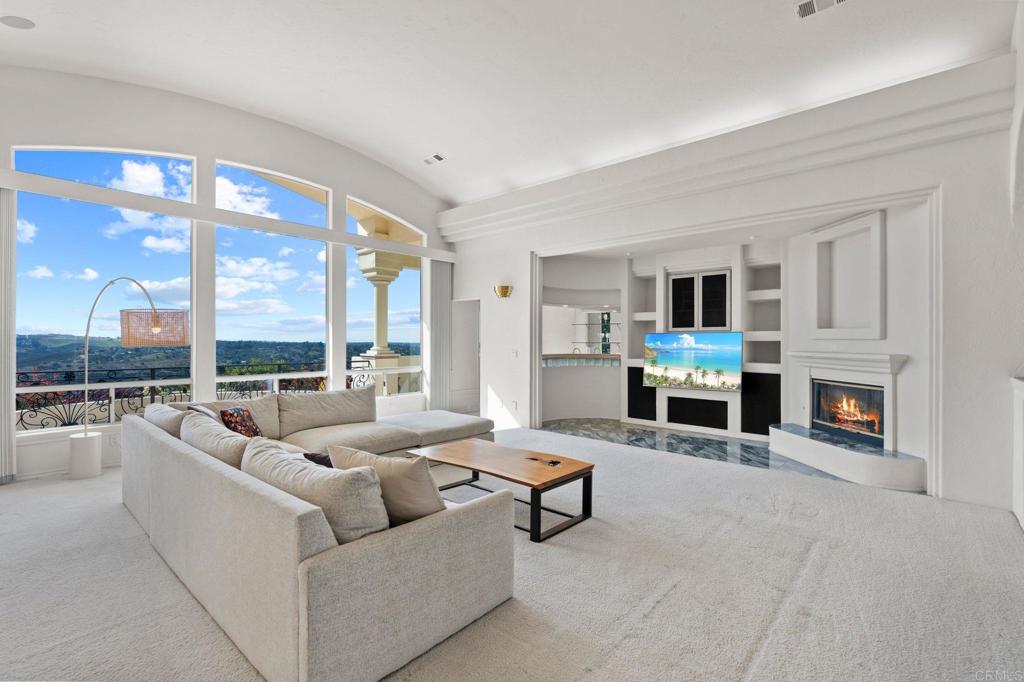 1402 Vista De Lomas Bonsall, CA 92003 - Photo 12 of 56 a living room with fireplace furniture and a large window