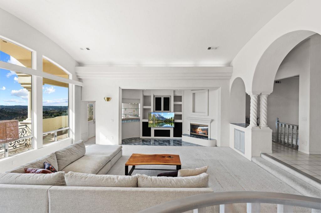 1402 Vista De Lomas Bonsall, CA 92003 - Photo 14 of 56 a living room with furniture and a fireplace