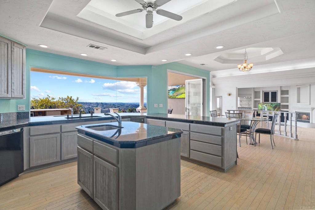 1402 Vista De Lomas Bonsall, CA 92003 - Photo 16 of 56 a kitchen with stainless steel appliances granite countertop a sink counter space cabinets and a stove