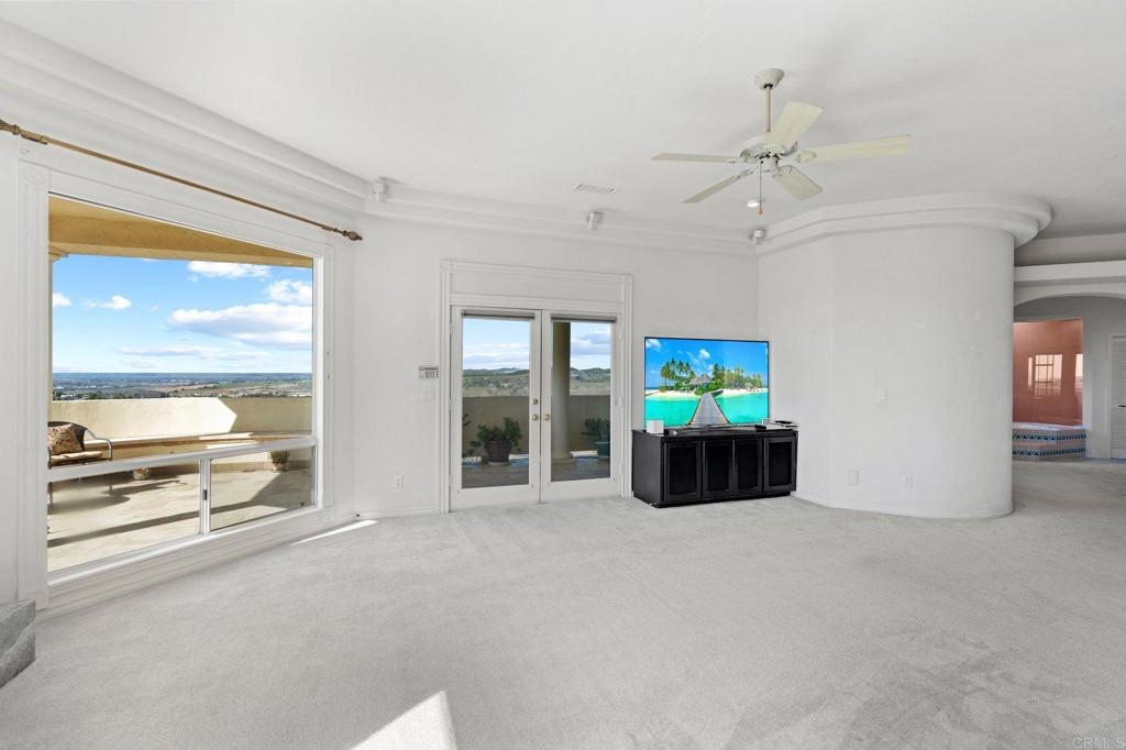 1402 Vista De Lomas Bonsall, CA 92003 - Photo 21 of 56 a large living room with furniture and a large window