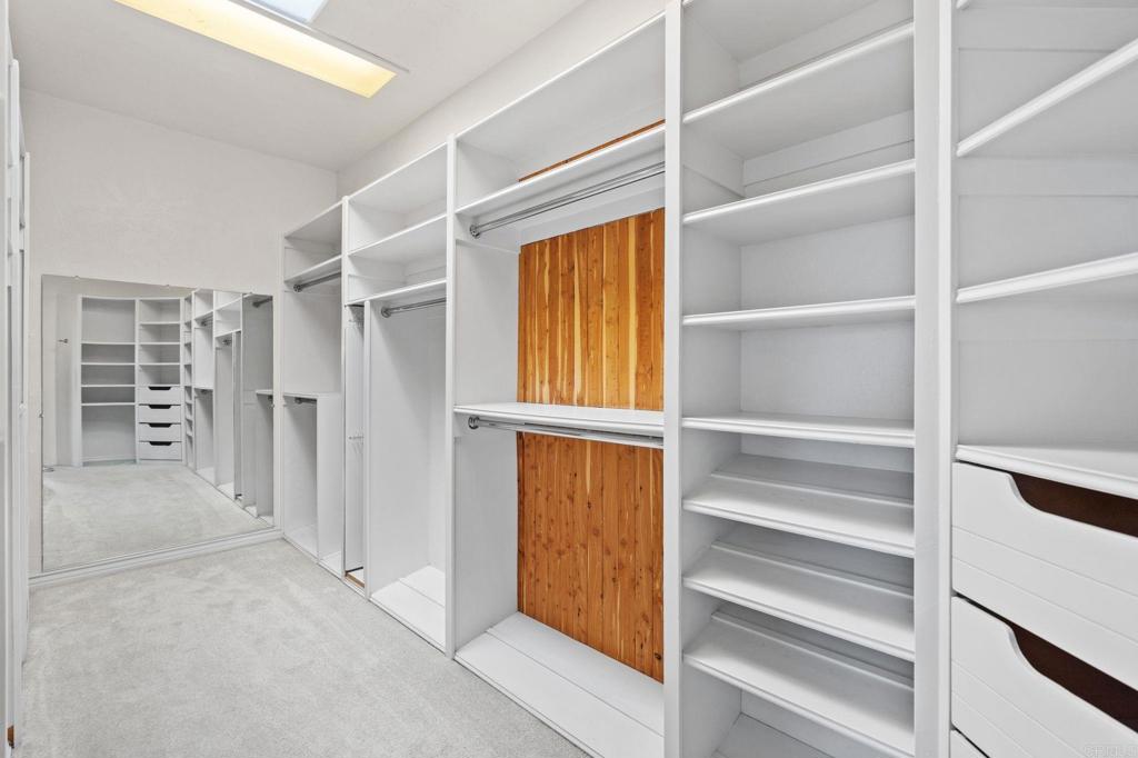 1402 Vista De Lomas Bonsall, CA 92003 - Photo 25 of 56 a view of walk in closet with empty racks