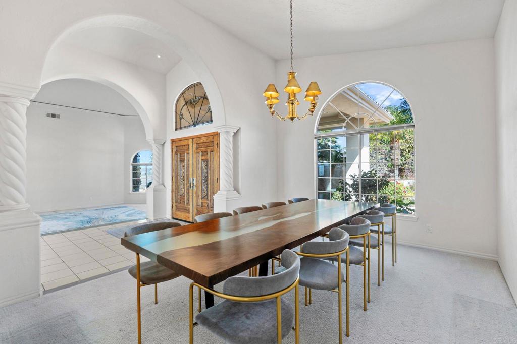 1402 Vista De Lomas Bonsall, CA 92003 - Photo 28 of 56 a view of a dining room with a table and chairs