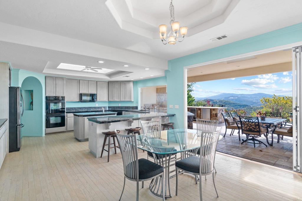 1402 Vista De Lomas Bonsall, CA 92003 - Photo 3 of 56 a view of a dining room with furniture window and outside view