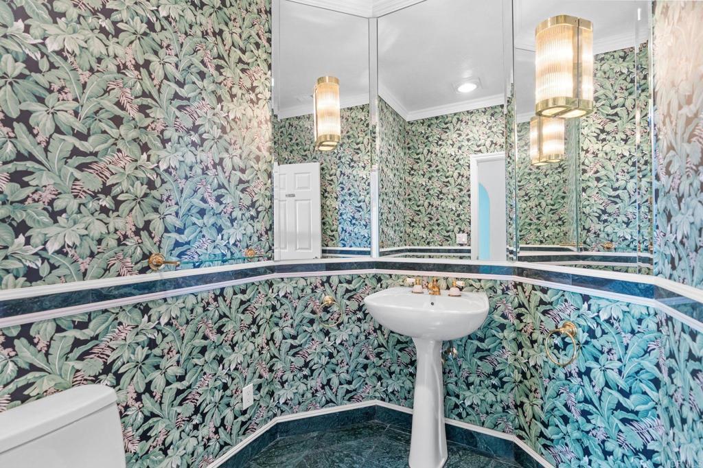 1402 Vista De Lomas Bonsall, CA 92003 - Photo 32 of 56 a bathroom with a sink and a mirror