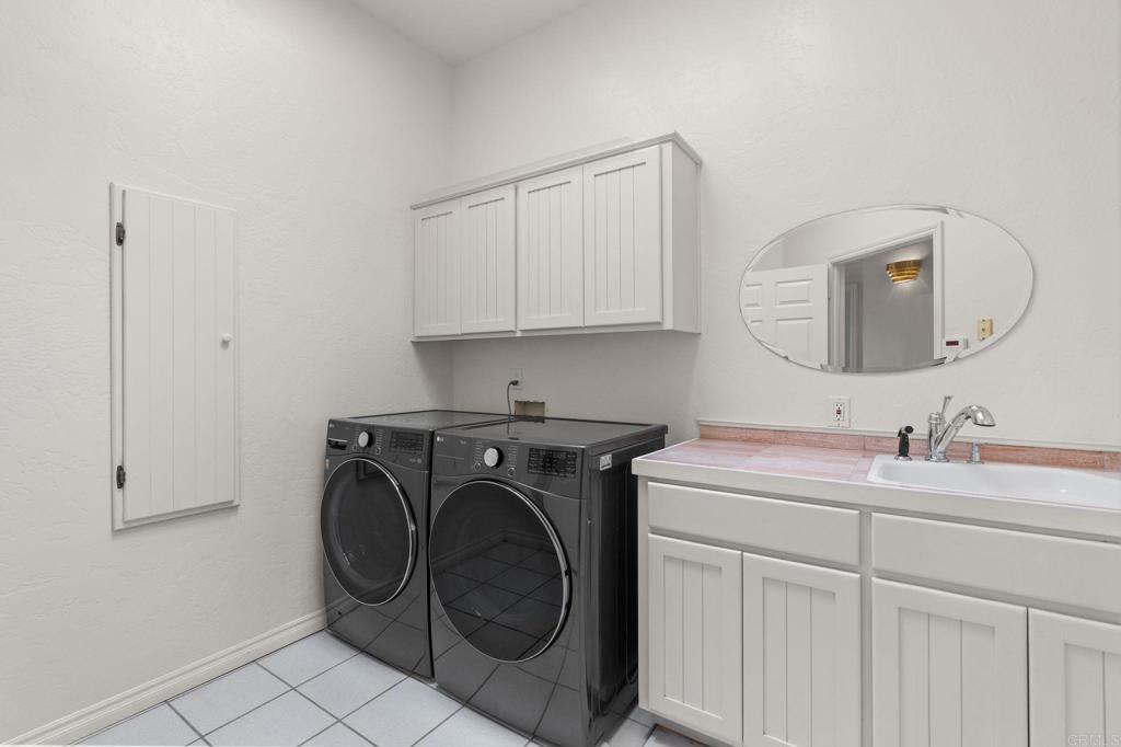 1402 Vista De Lomas Bonsall, CA 92003 - Photo 33 of 56 a utility room with sink dryer and washer