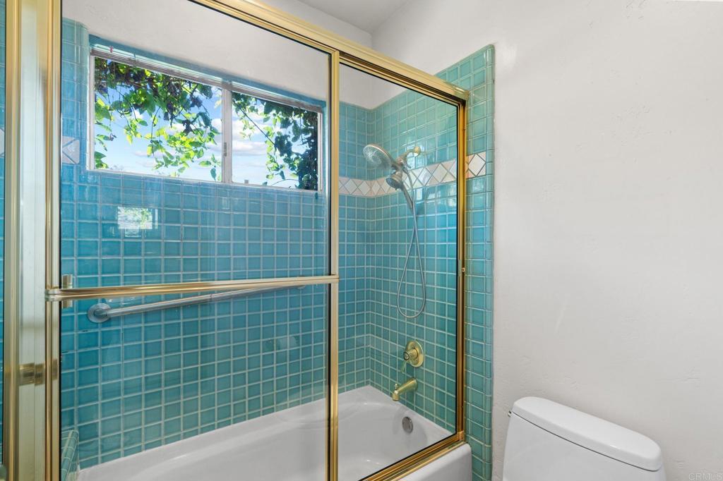 1402 Vista De Lomas Bonsall, CA 92003 - Photo 35 of 56 a bathroom with a shower and a toilet