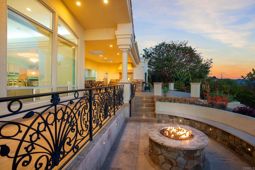 1402 Vista De Lomas Bonsall, CA 92003 - Photo 45 of 56 a view of a patio with a table and chairs with wooden floor and fence