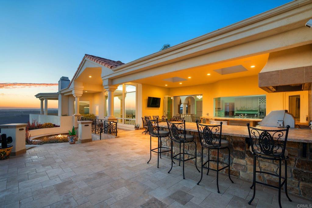 1402 Vista De Lomas Bonsall, CA 92003 - Photo 46 of 56 a view of a patio with dining table and chairs