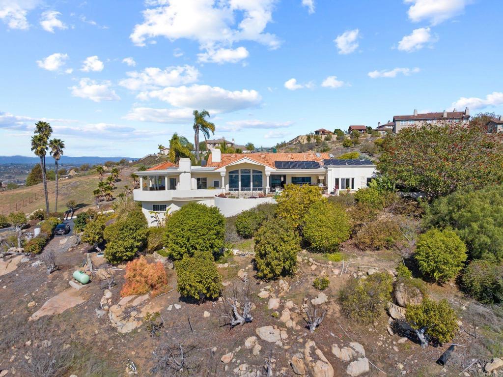 1402 Vista De Lomas Bonsall, CA 92003 - Photo 51 of 56 a view of a houses with a yard