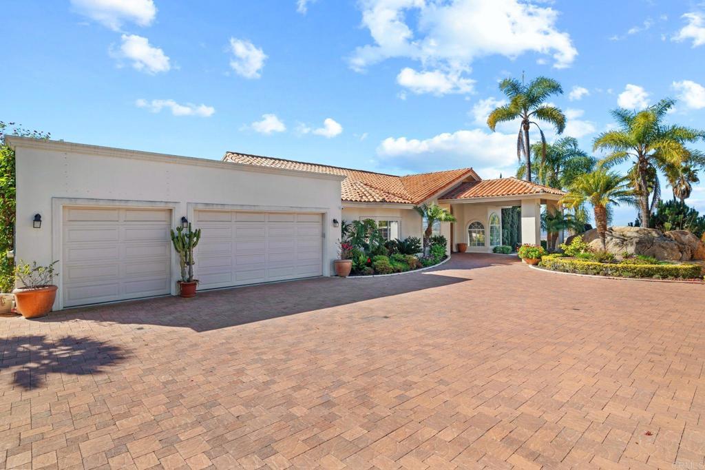1402 Vista De Lomas Bonsall, CA 92003 - Photo 8 of 56 a view of a house with a yard and potted plants