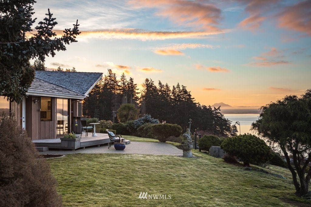 a view of a lake with a house in the background