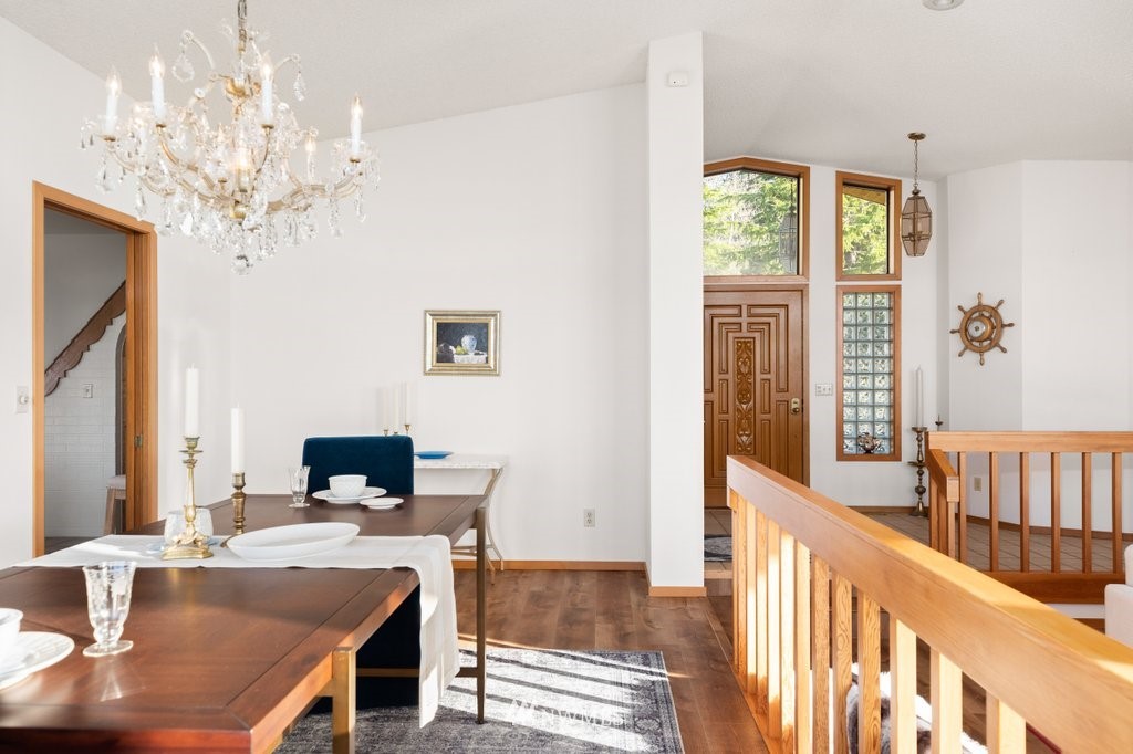 1860 East Hunskor Road Oak Harbor, WA 98277 - Photo 11 of 40 a view of a dining room with furniture window and wooden floor