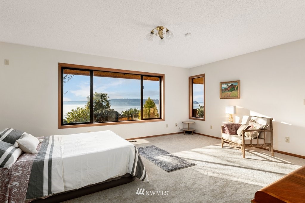 1860 East Hunskor Road Oak Harbor, WA 98277 - Photo 21 of 40 a living room with furniture and a large window