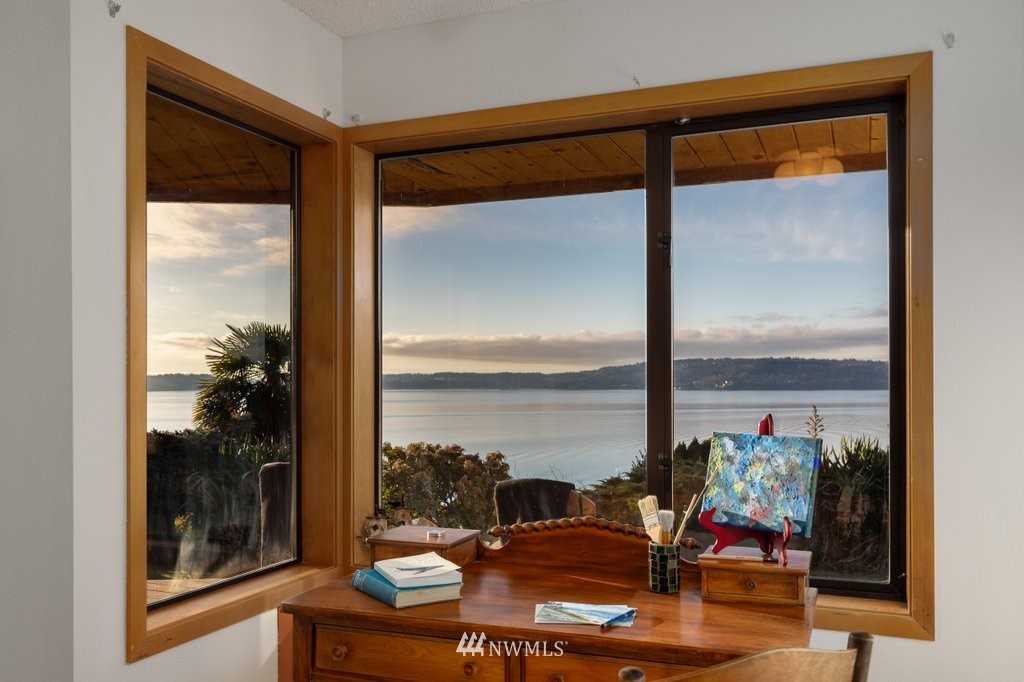 1860 East Hunskor Road Oak Harbor, WA 98277 - Photo 26 of 40 a living room with a floor to ceiling window and floor to ceiling window