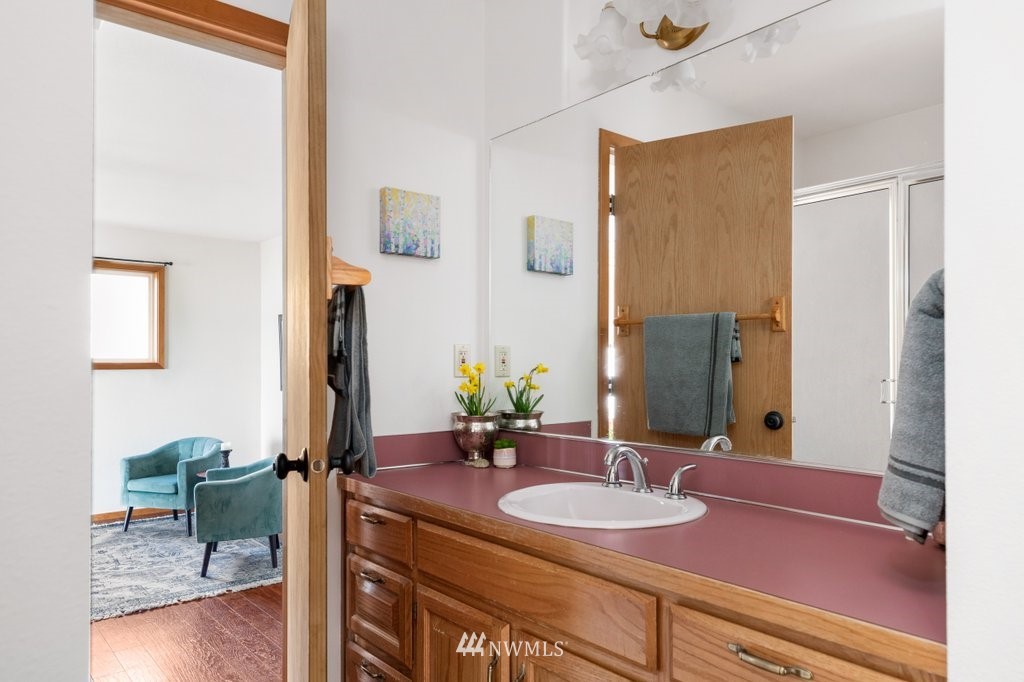 1860 East Hunskor Road Oak Harbor, WA 98277 - Photo 32 of 40 a bathroom with a sink and a mirror