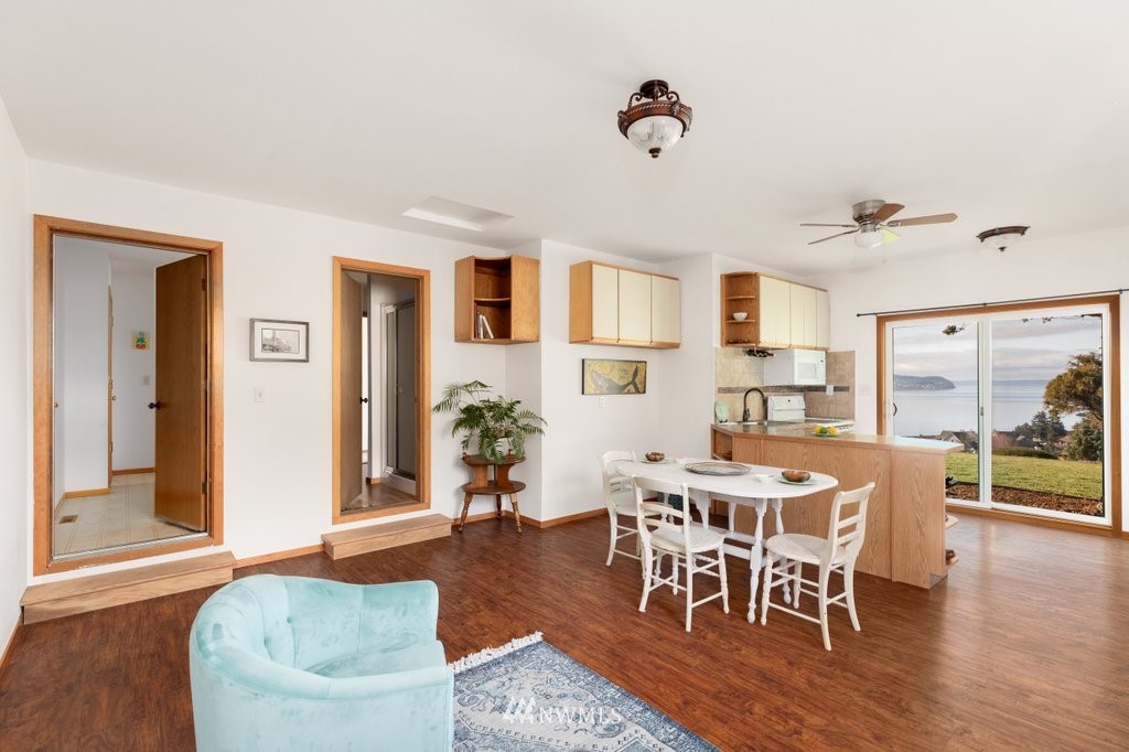 1860 East Hunskor Road Oak Harbor, WA 98277 - Photo 33 of 40 a view of a dining room with furniture and wooden floor