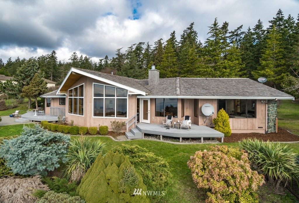 1860 East Hunskor Road Oak Harbor, WA 98277 - Photo 39 of 40 a front view of house with a garden and patio