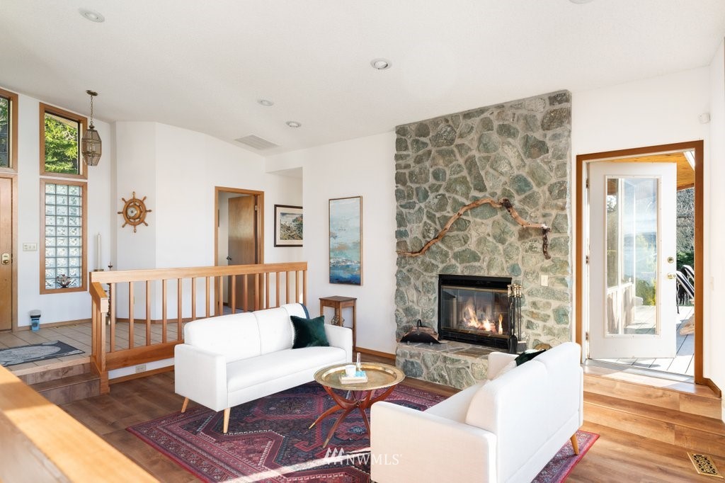 1860 East Hunskor Road Oak Harbor, WA 98277 - Photo 9 of 40 a living room with furniture and a fireplace