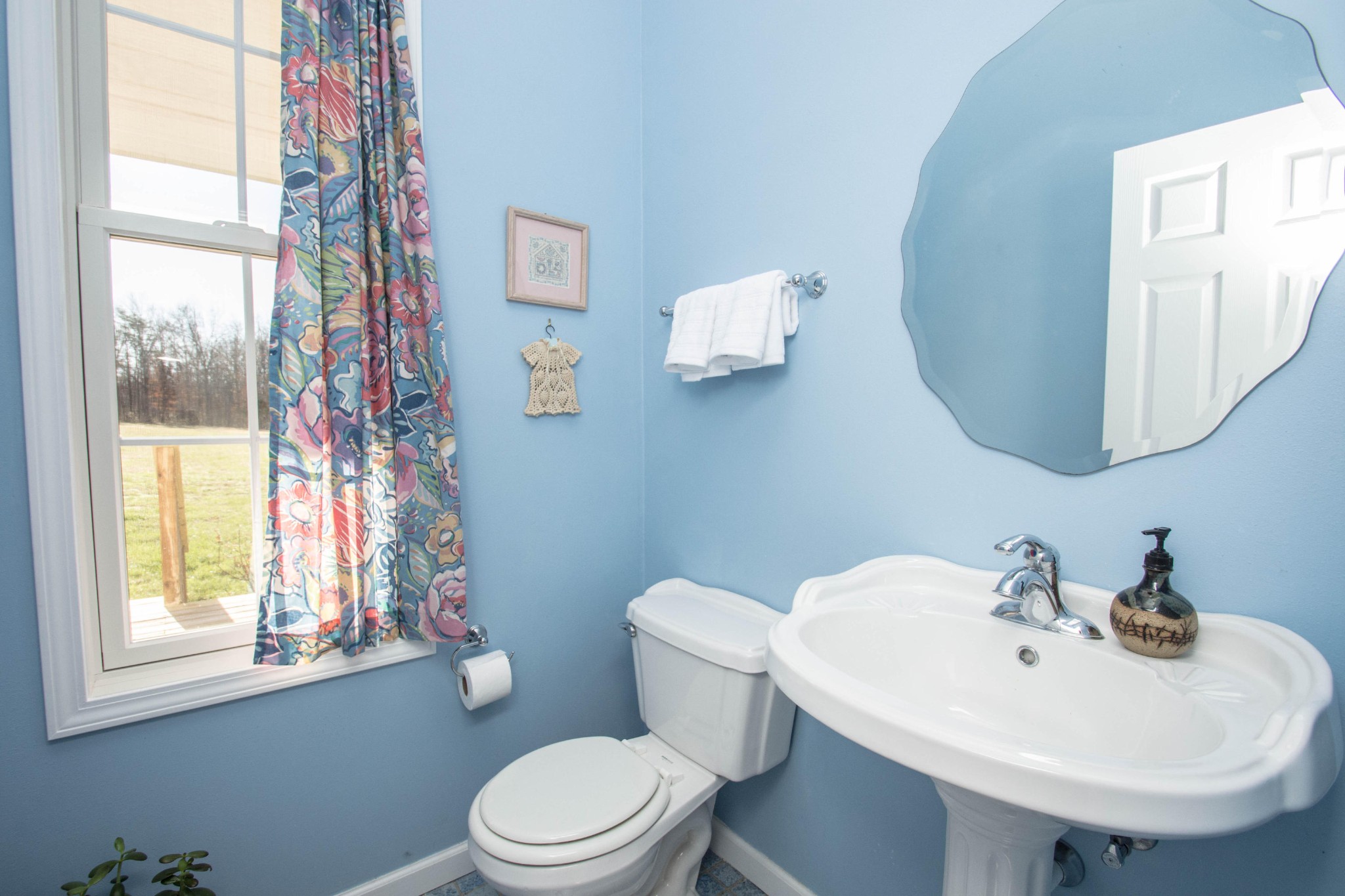 1439 Keyes Road Crossville, TN 38571 - Photo 27 of 40 a white toilet sitting next to a bathroom sink
