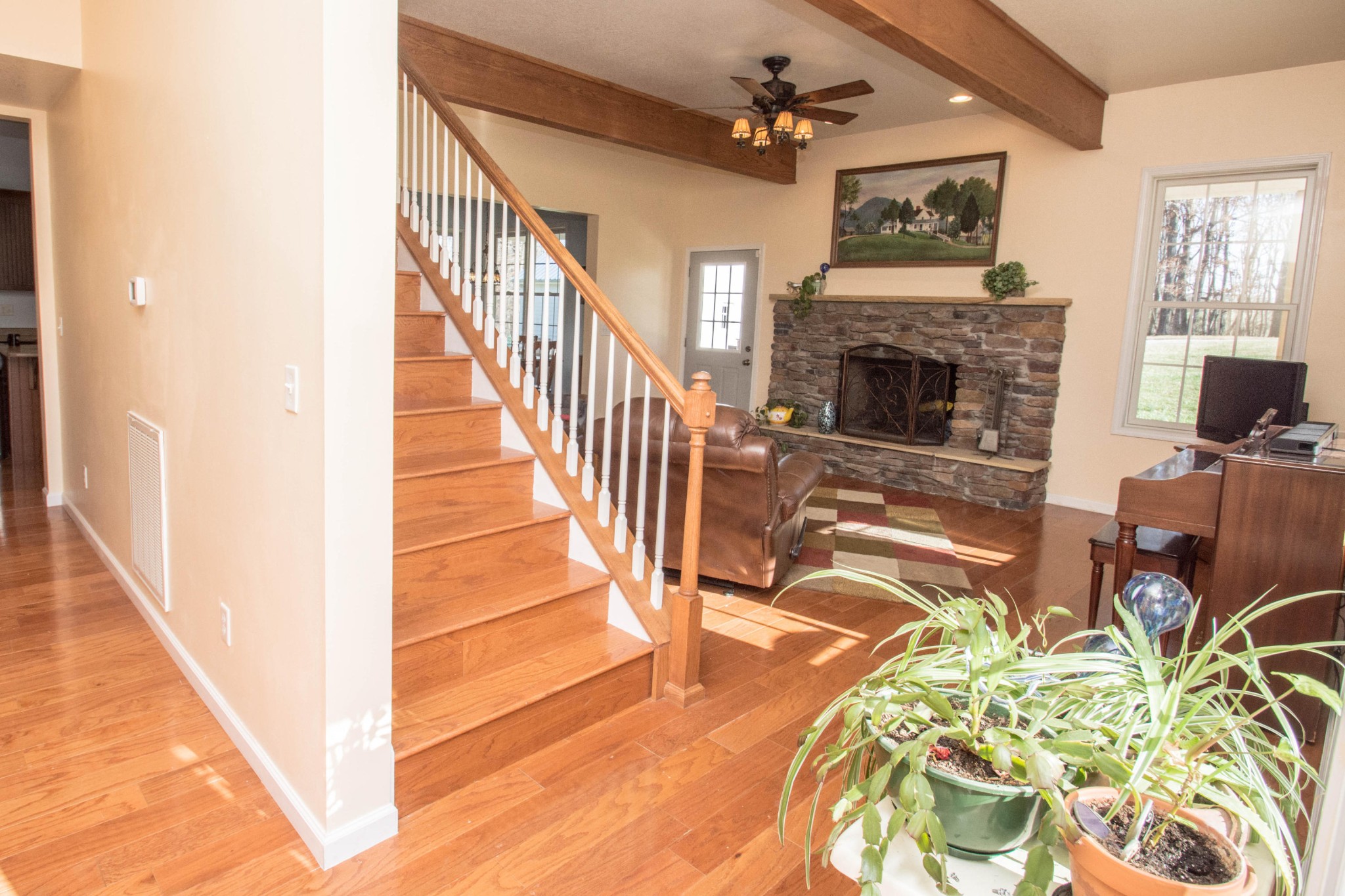 1439 Keyes Road Crossville, TN 38571 - Photo 9 of 40 a view of a livingroom with furniture a fireplace chandeliers