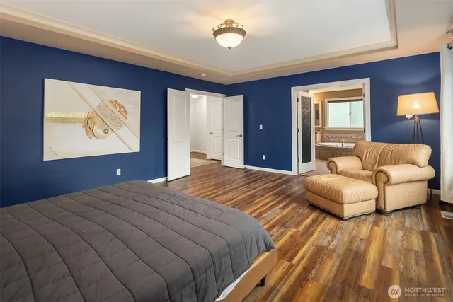 a bedroom with a bed and a couch