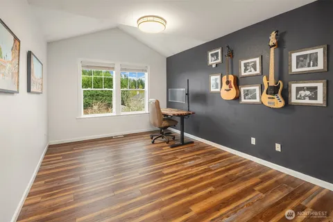 a room with gym equipment and a large window