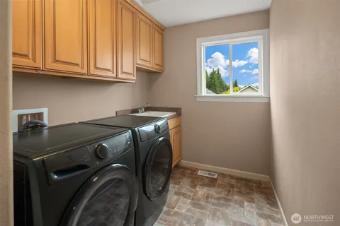 a utility room with dryer and washer