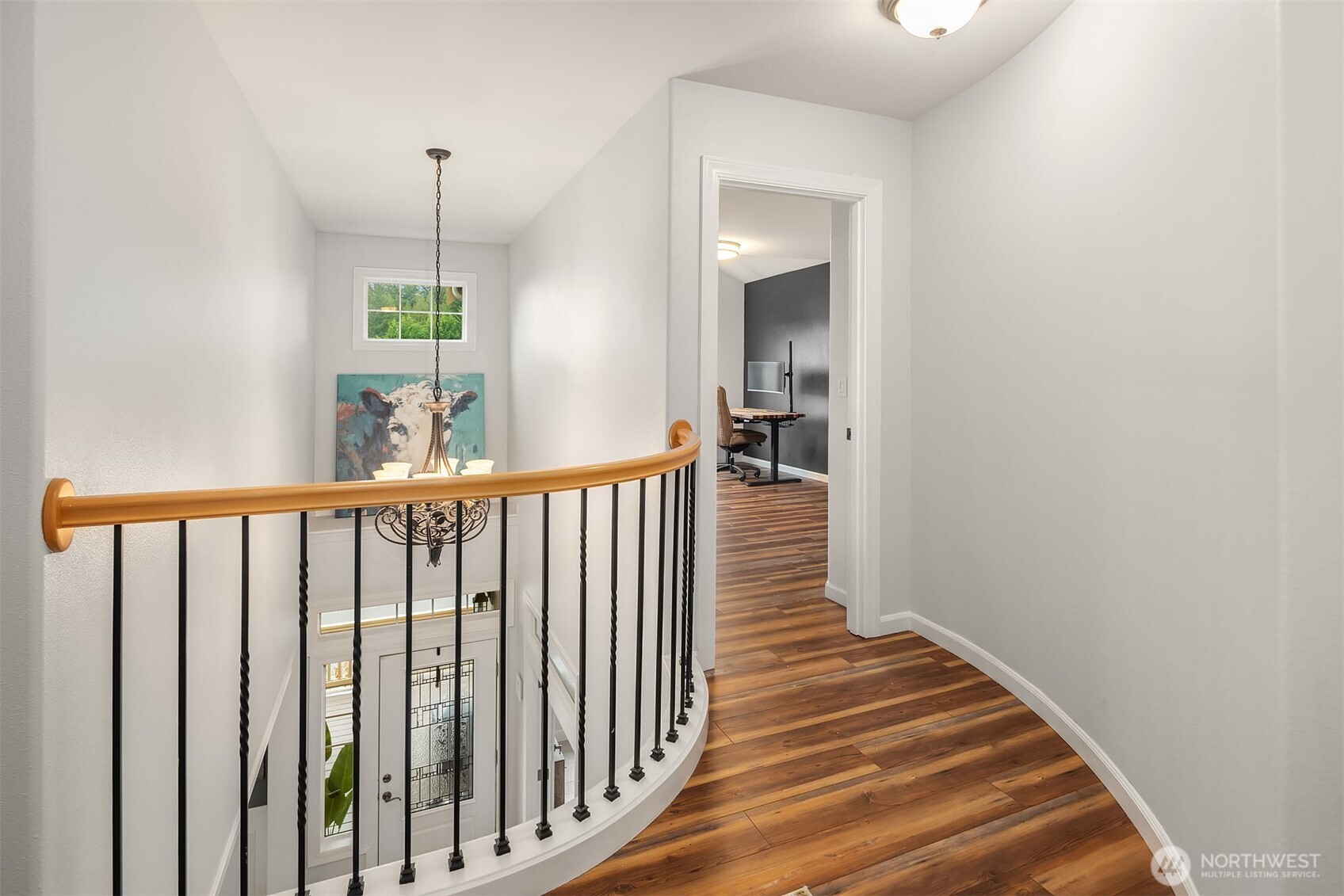 12902 194th Ave Court East Bonney Lake, WA 98391 - Photo 28 of 40 a view of a hallway with wooden floor and stairs