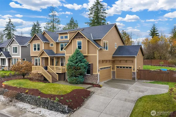 a view of house with yard and entertaining space