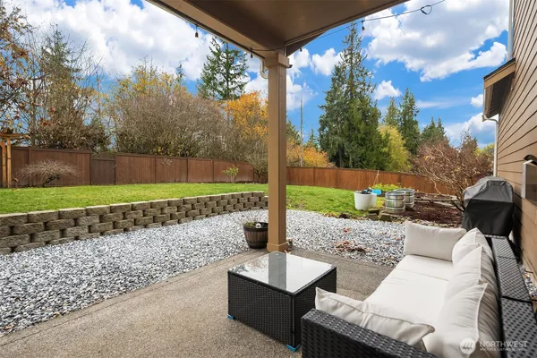 a view of a patio with a yard