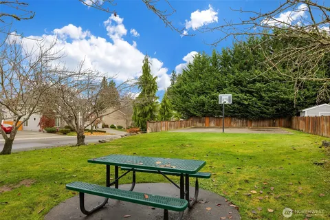 a view of a backyard with sitting area