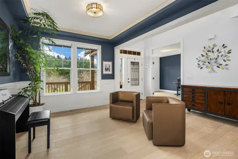a living room with furniture and windows