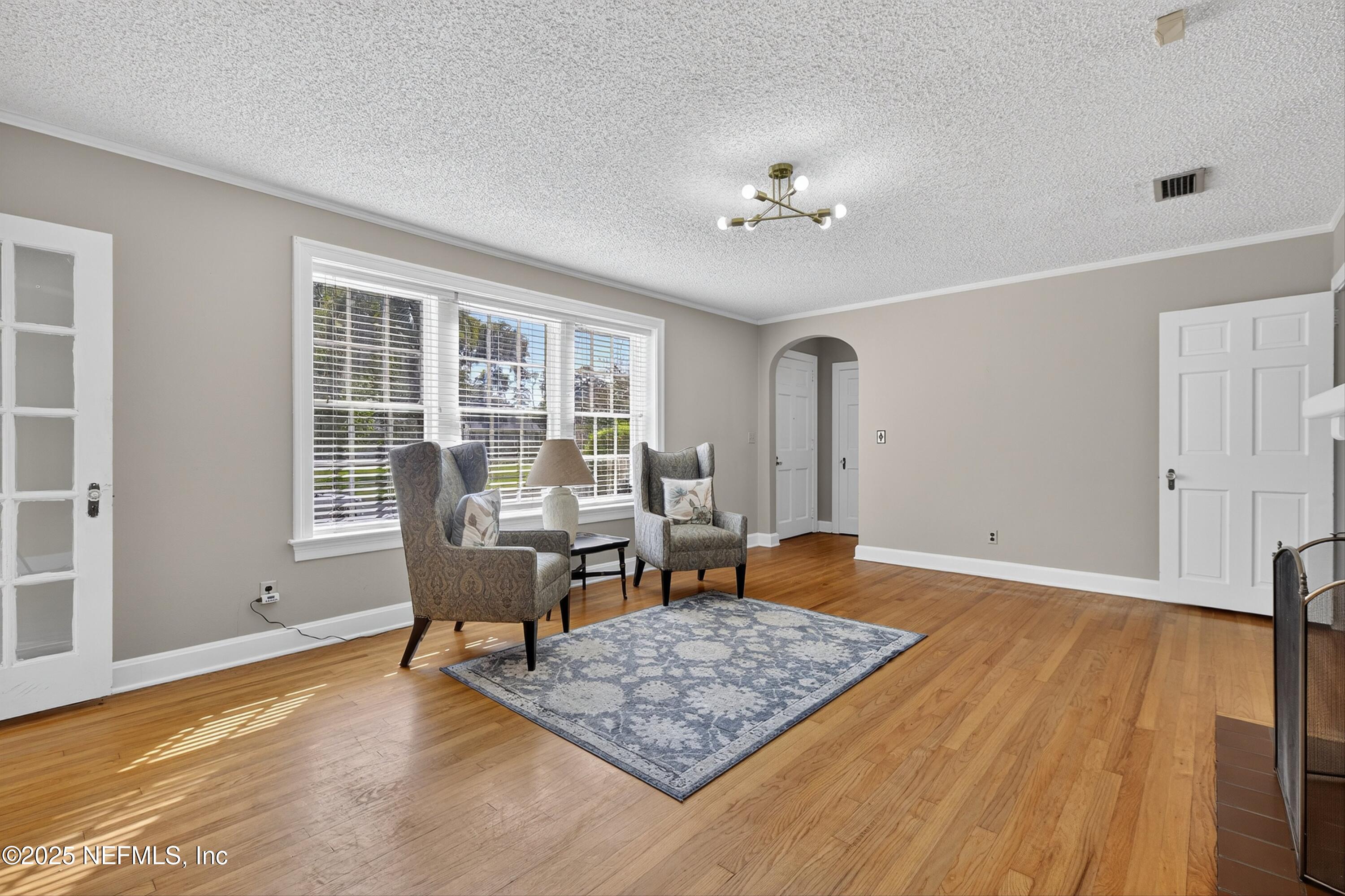 1425 Pinetree Road Jacksonville, FL 32207 - Photo 16 of 39 a living room with furniture rug and window