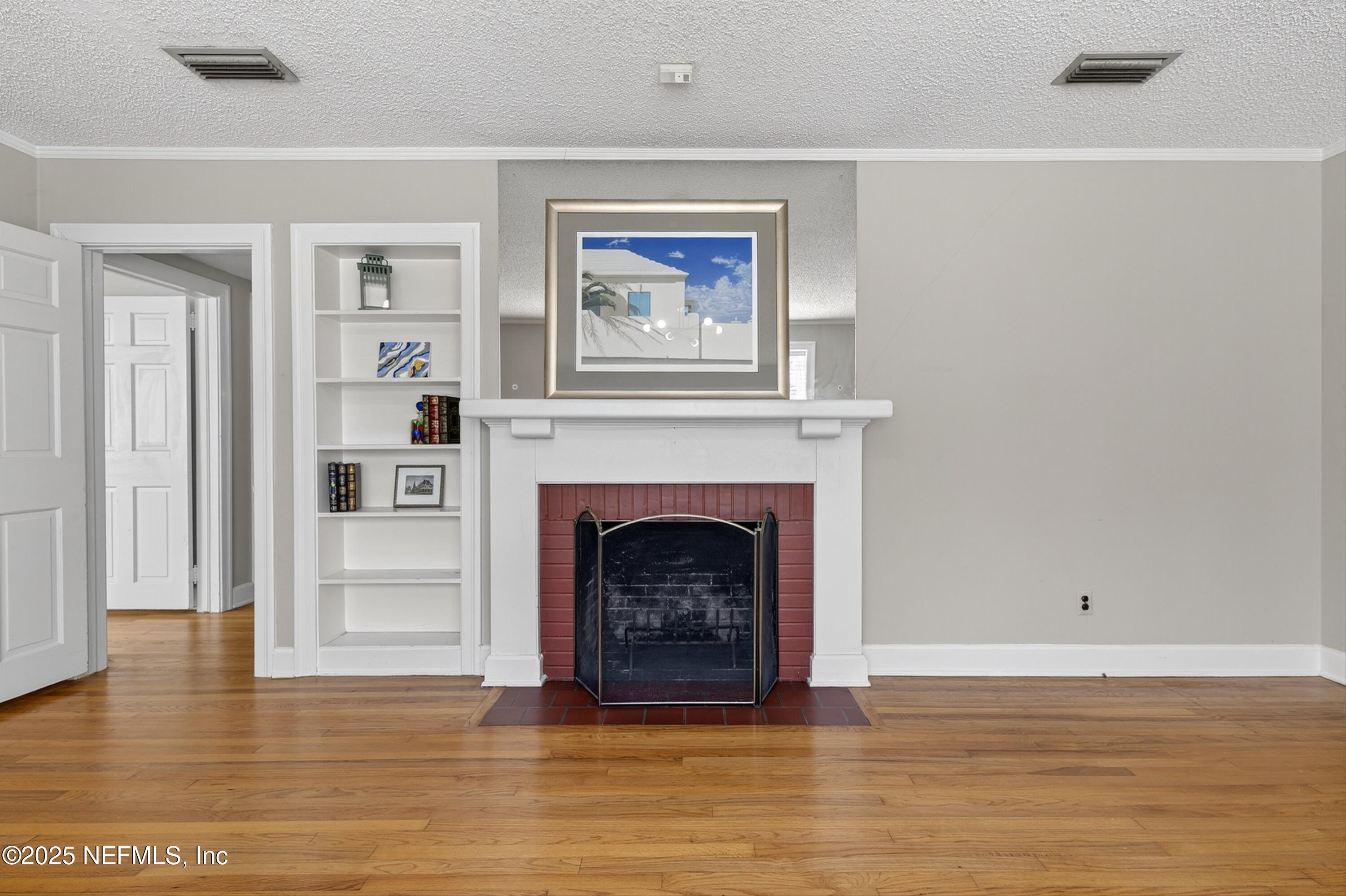 1425 Pinetree Road Jacksonville, FL 32207 - Photo 17 of 39 a living room with furniture and a fireplace